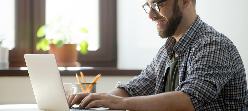 Professional working on a laptop, illustrating FINcredible integration services.
