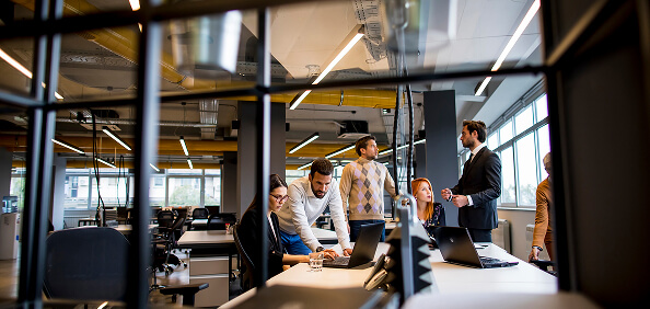 Business professionals collaborating in a modern open-plan office.