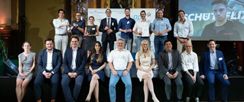 FINcredible team and award ceremony participants on stage in 2021.